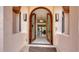 Elegant arched double front doors lead into the foyer with views of the bright interior at 279 Robin Dr, Sarasota, FL 34236