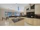 Bright kitchen featuring white cabinetry, dark countertops, and a cozy breakfast nook with waterfront views at 279 Robin Dr, Sarasota, FL 34236
