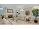 Spacious living room with fireplace, neutral decor, and large windows for ample natural light at 279 Robin Dr, Sarasota, FL 34236