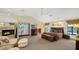 Large main bedroom with fireplace, sitting area, and access to outdoor patio at 279 Robin Dr, Sarasota, FL 34236