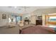 Spacious main bedroom suite features a fireplace, private balcony, and ensuite bathroom at 279 Robin Dr, Sarasota, FL 34236