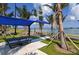 Public waterfront area with benches and shade at 279 Robin Dr, Sarasota, FL 34236