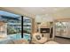 Bright sitting area with fireplace and views of the pool and marina at 279 Robin Dr, Sarasota, FL 34236