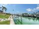 Home's private boat lift and serene waterfront at 279 Robin Dr, Sarasota, FL 34236
