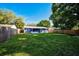 Large backyard with grassy lawn and a newly painted house at 3110 Elmer St, Sarasota, FL 34231