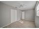 Bright bedroom with double door closet and ceiling fan at 3110 Elmer St, Sarasota, FL 34231