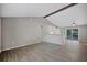 Open concept dining area with wood beam and gray walls at 3110 Elmer St, Sarasota, FL 34231