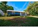 Newly renovated blue house with a metal roof and a two-car garage at 3110 Elmer St, Sarasota, FL 34231