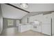 Modern kitchen with white cabinets, gray walls, and tile floors at 3110 Elmer St, Sarasota, FL 34231