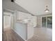 Modern kitchen with white cabinets, gray walls, and tile floors at 3110 Elmer St, Sarasota, FL 34231