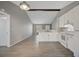 Open concept kitchen with white cabinets and gray walls at 3110 Elmer St, Sarasota, FL 34231