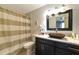 Updated bathroom with granite vanity and copper sink at 3206 Ramblewood N Dr # 18D, Sarasota, FL 34237