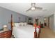 Large bedroom with king bed, dresser, and access to a second bathroom at 3206 Ramblewood N Dr # 18D, Sarasota, FL 34237