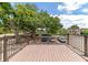 Private deck overlooking a tree-filled courtyard at 3206 Ramblewood N Dr # 18D, Sarasota, FL 34237