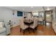 Open concept dining area with wood table and chairs at 3206 Ramblewood N Dr # 18D, Sarasota, FL 34237