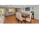 Dining room with wood table and gray couches at 3206 Ramblewood N Dr # 18D, Sarasota, FL 34237