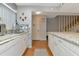 White kitchen with granite countertops and stainless steel appliances at 3206 Ramblewood N Dr # 18D, Sarasota, FL 34237