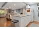 Bright kitchen with granite countertops and white cabinets at 3206 Ramblewood N Dr # 18D, Sarasota, FL 34237