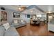 Living room with gray sectional sofa and ceiling fan at 3206 Ramblewood N Dr # 18D, Sarasota, FL 34237