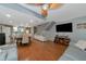 Open concept living room with gray couches and dining area at 3206 Ramblewood N Dr # 18D, Sarasota, FL 34237