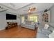 Living room with gray couches and a large TV at 3206 Ramblewood N Dr # 18D, Sarasota, FL 34237