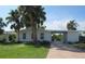 Updated single-story home with carport and tropical landscaping at 3301 Ash St, Punta Gorda, FL 33950