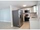 Modern kitchen with stainless steel appliances and white cabinets at 3301 Ash St, Punta Gorda, FL 33950