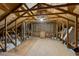Spacious attic with exposed wooden beams, insulation, and ample storage or conversion potential at 3310 Twin Rivers Trl, Parrish, FL 34219