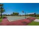 Community basketball court next to the park with green space and an outdoor seating area at 3310 Twin Rivers Trl, Parrish, FL 34219