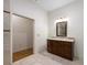 Clean bathroom with marble floors, walk-in shower, and dark wood vanity at 3310 Twin Rivers Trl, Parrish, FL 34219