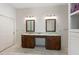Bathroom features and sinks with brown wood cabinets and neutral countertops at 3310 Twin Rivers Trl, Parrish, FL 34219