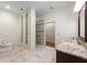Bright bathroom with marble floors, walk-in shower, and a stylish vanity at 3310 Twin Rivers Trl, Parrish, FL 34219