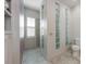 Bright bathroom with large, tiled shower and privacy glass block window at 3310 Twin Rivers Trl, Parrish, FL 34219