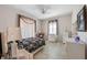 Bright bedroom with tile floors, decorative curtains and ample natural light at 3310 Twin Rivers Trl, Parrish, FL 34219