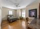 Bedroom features a large window, ceiling fan, and a wooden desk area at 3310 Twin Rivers Trl, Parrish, FL 34219