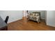 Cozy bedroom with hardwood floors and a comfortable bed at 3310 Twin Rivers Trl, Parrish, FL 34219