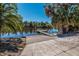 Community boat ramp leading to the river, surrounded by lush tropical trees at 3310 Twin Rivers Trl, Parrish, FL 34219