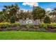 Stone community sign surrounded by lush landscaping at 3310 Twin Rivers Trl, Parrish, FL 34219