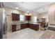 Beautiful kitchen featuring granite countertops and a view of the dining area at 3310 Twin Rivers Trl, Parrish, FL 34219