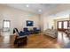 Bright living room with hardwood floors, comfortable seating, and ample natural light at 3310 Twin Rivers Trl, Parrish, FL 34219