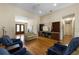 Spacious living room showcasing hardwood floors, a built-in cabinet, and a cozy ambiance at 3310 Twin Rivers Trl, Parrish, FL 34219