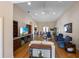 Open-concept living room featuring hardwood floors, built-in cabinets, and comfortable seating at 3310 Twin Rivers Trl, Parrish, FL 34219