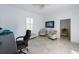 Bright office features tiled floors and comfortable seating with a large TV at 3310 Twin Rivers Trl, Parrish, FL 34219
