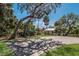 Lush green park with a covered seating area, boat dock, and ample space for recreation at 3310 Twin Rivers Trl, Parrish, FL 34219