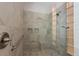 Modern tiled shower features shower bench seating and shower niche at 3310 Twin Rivers Trl, Parrish, FL 34219
