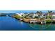 Waterfront property with private dock, lush landscaping, and tranquil water views, creating a serene outdoor space at 3580 Fair Oaks Ln, Longboat Key, FL 34228