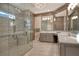 Spa-like bathroom with a walk-in shower, dual vanities, and modern fixtures at 3580 Fair Oaks Ln, Longboat Key, FL 34228