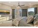 Comfortable bedroom with a king-size bed, neutral decor, and access to the outdoors at 3580 Fair Oaks Ln, Longboat Key, FL 34228