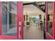 Inviting foyer with a grand staircase, bright natural light, and a glimpse into the stylishly decorated living area at 3580 Fair Oaks Ln, Longboat Key, FL 34228