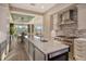 Gourmet kitchen boasts a large island, stainless steel appliances, and open design at 3580 Fair Oaks Ln, Longboat Key, FL 34228